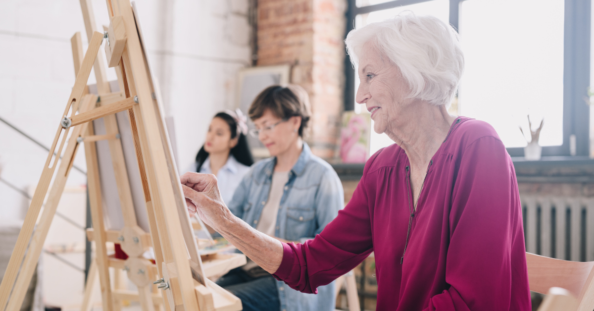 Senior Artist Painting in Art Studio